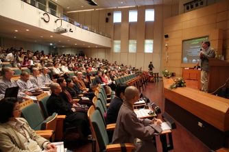 Prof. Richard Davidson speaking at a conference on science and meditation in the college's conference hall