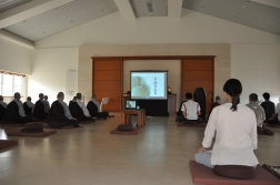 Watching an instruction DVD by master Sheng Yen during a one-day retreat